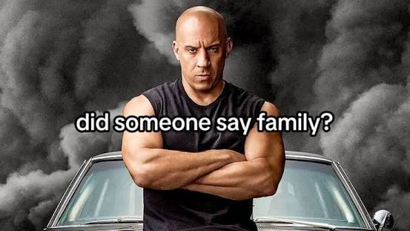 Dominic Toretto standing in front of a car, with the words did someone say family?